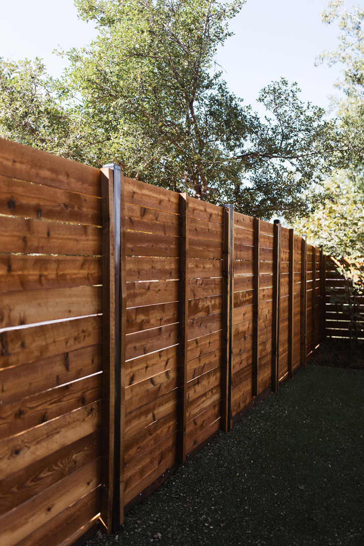 Newly built timber horizontal paling fence on residential property.
