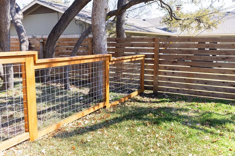 Newly built PVC Hampton style fence on residential property.