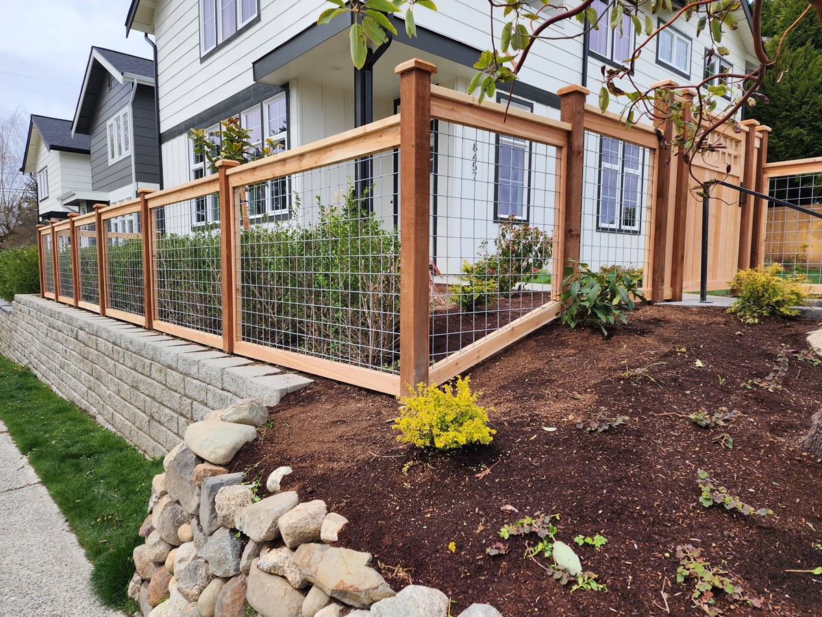 Newly built stylish bullwire fence on residential property.