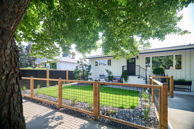 Newly built Colorbond fence with exposed timber posts on residential property.