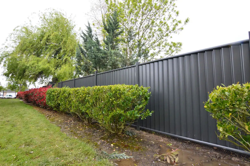 Newly built PVC Hampton style fence on residential property.