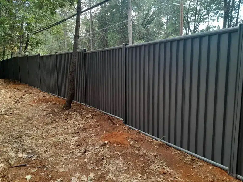 Newly built timber sleeper retaining wall on residential property.