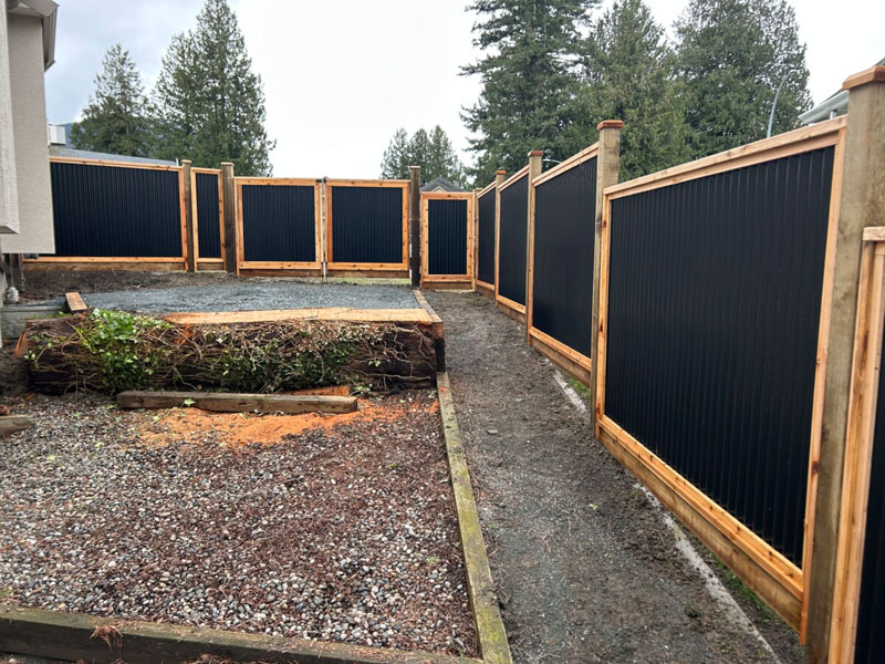 Newly built PVC picket fence on residential property.