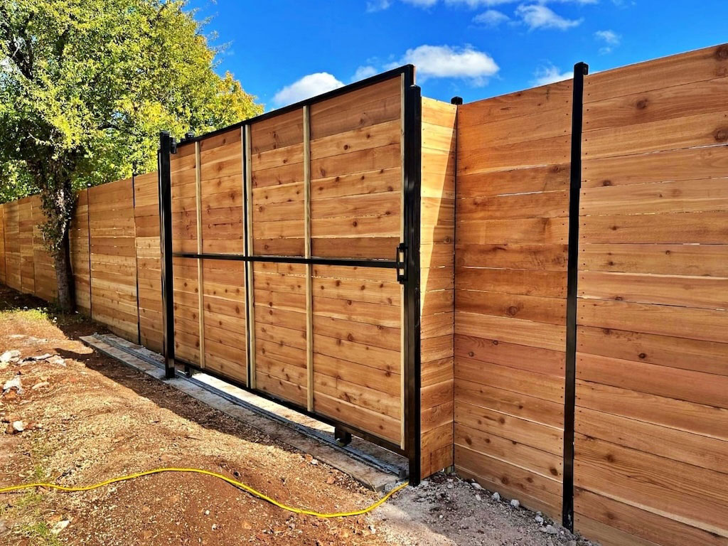 Newly built timber sliding gate on steel frame installed at residential property