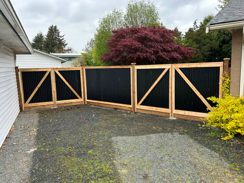 Newly built Colorbond Gate with exposed timber posts on residential property.