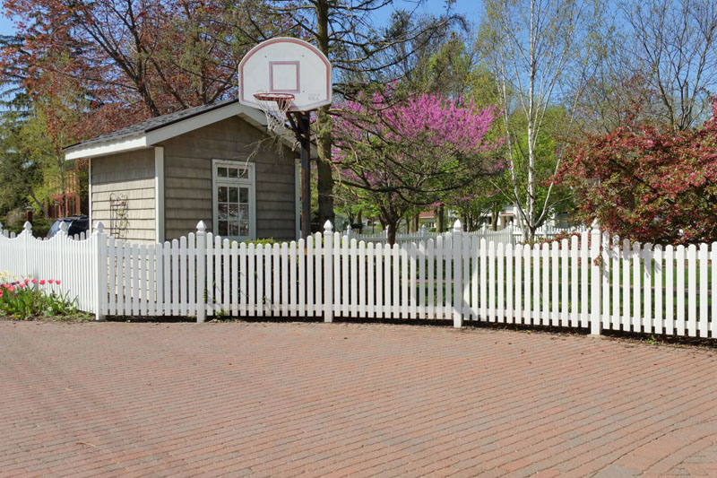 Newly built Colorbond fence with exposed timber posts on residential property.