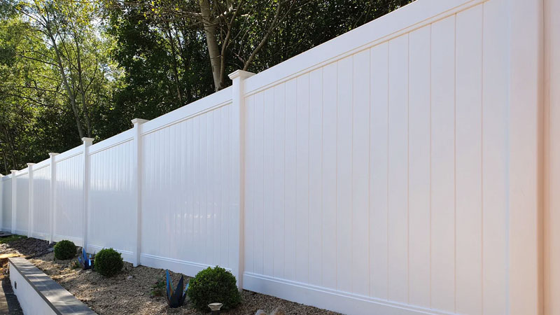 Newly built PVC Hampton style fence on residential property.