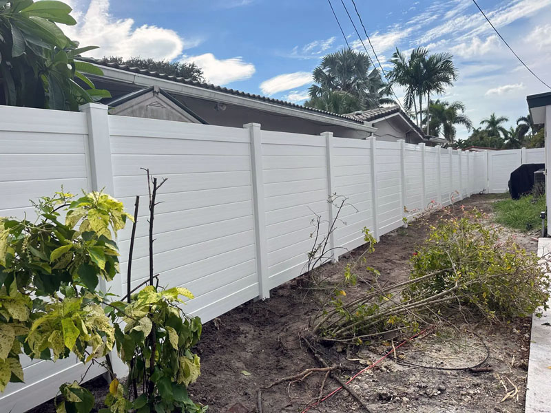 Newly built PVC Hampton style fence on residential property.
