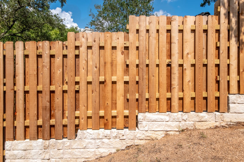 Newly built timber offset paling fence on residential property.