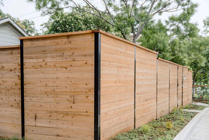 Newly built timber sleeper retaining wall on residential property.