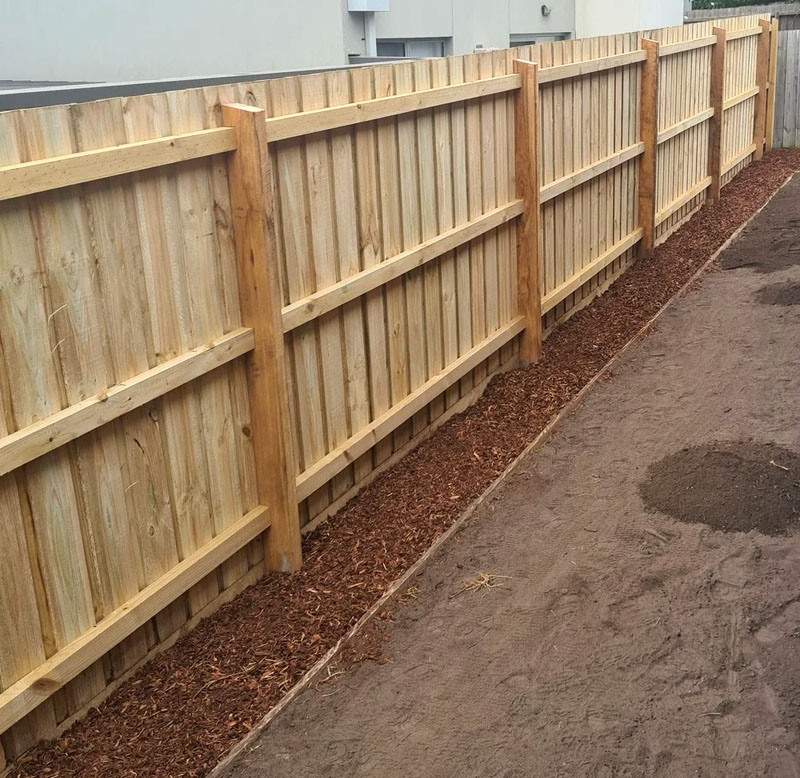 Newly built timber paling fence on residential property.